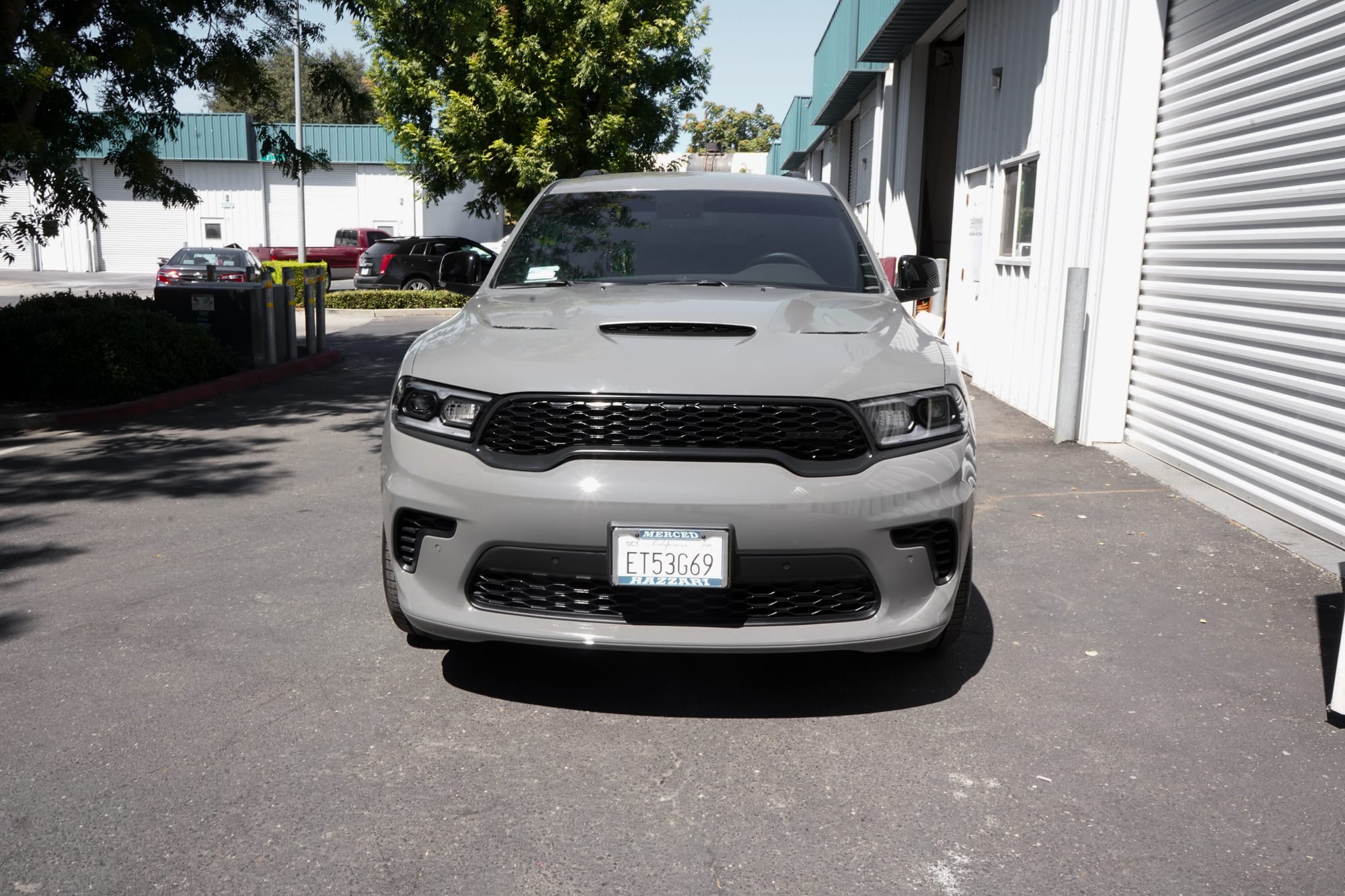 Grey Dodge Durango with paint protection film, front on, outside the Oakdale shop